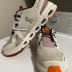 On Running Cream and Orange Athletic Shoes